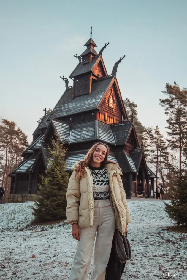 Girl standing infront of Gol Stave Church in the Norwegian Folkmuseum