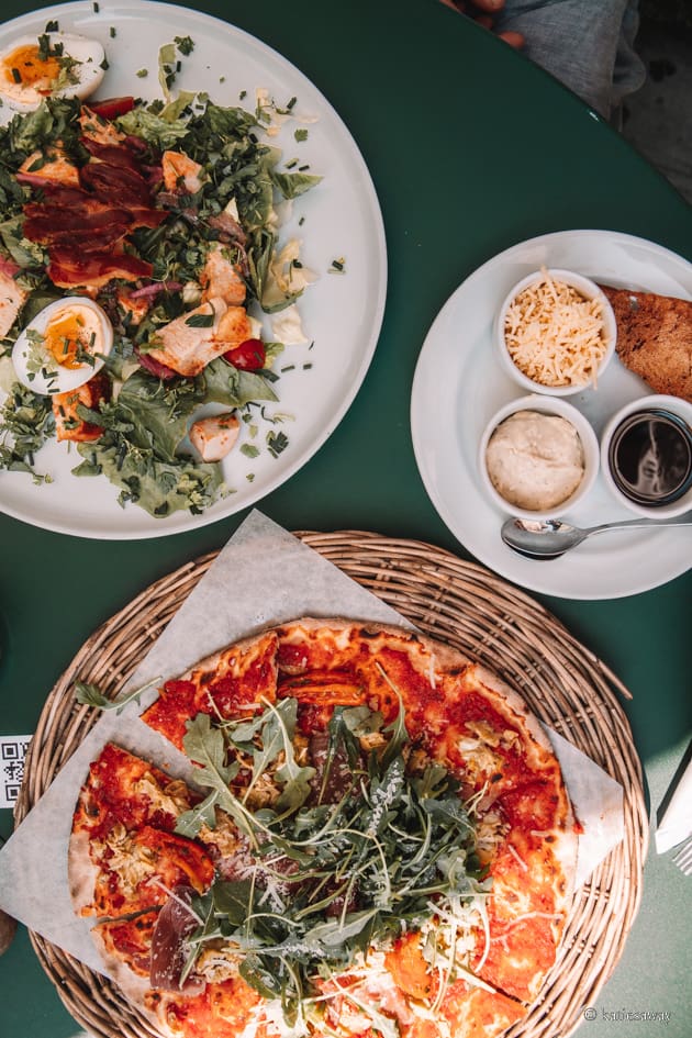 pizza and caesar salad from a restaurant in simrishamn