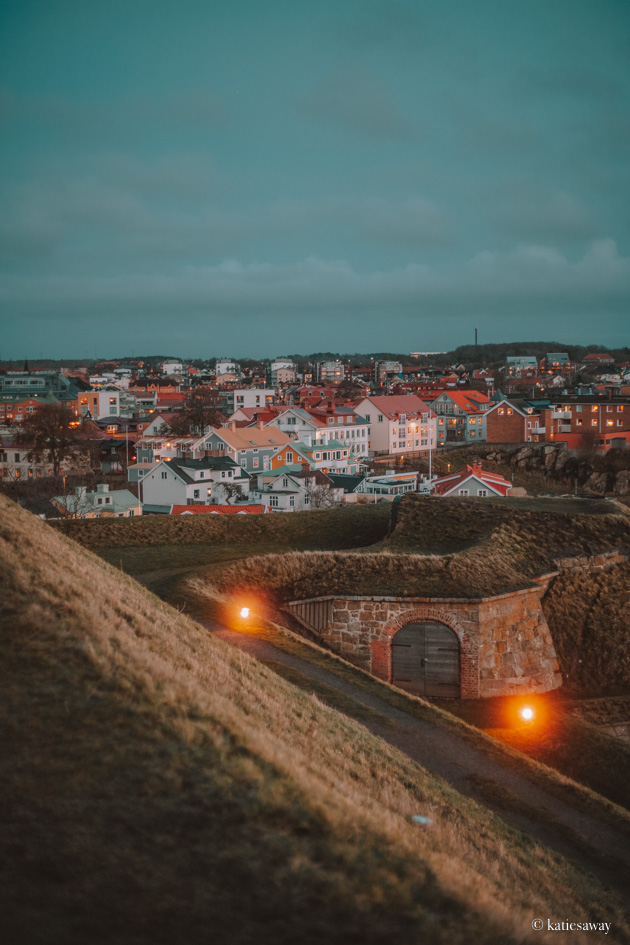 the view from varberg fortress over the town with the castle wall in the foreground