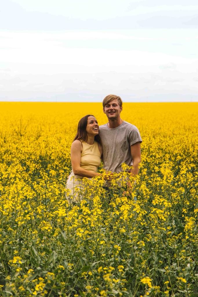 couple in a rapeseed field