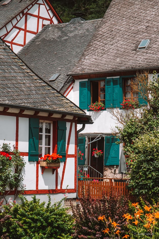 The half-timbered houses of Monreal, Germany. They have slate roofs, red timbers on white buildings and blue shutters