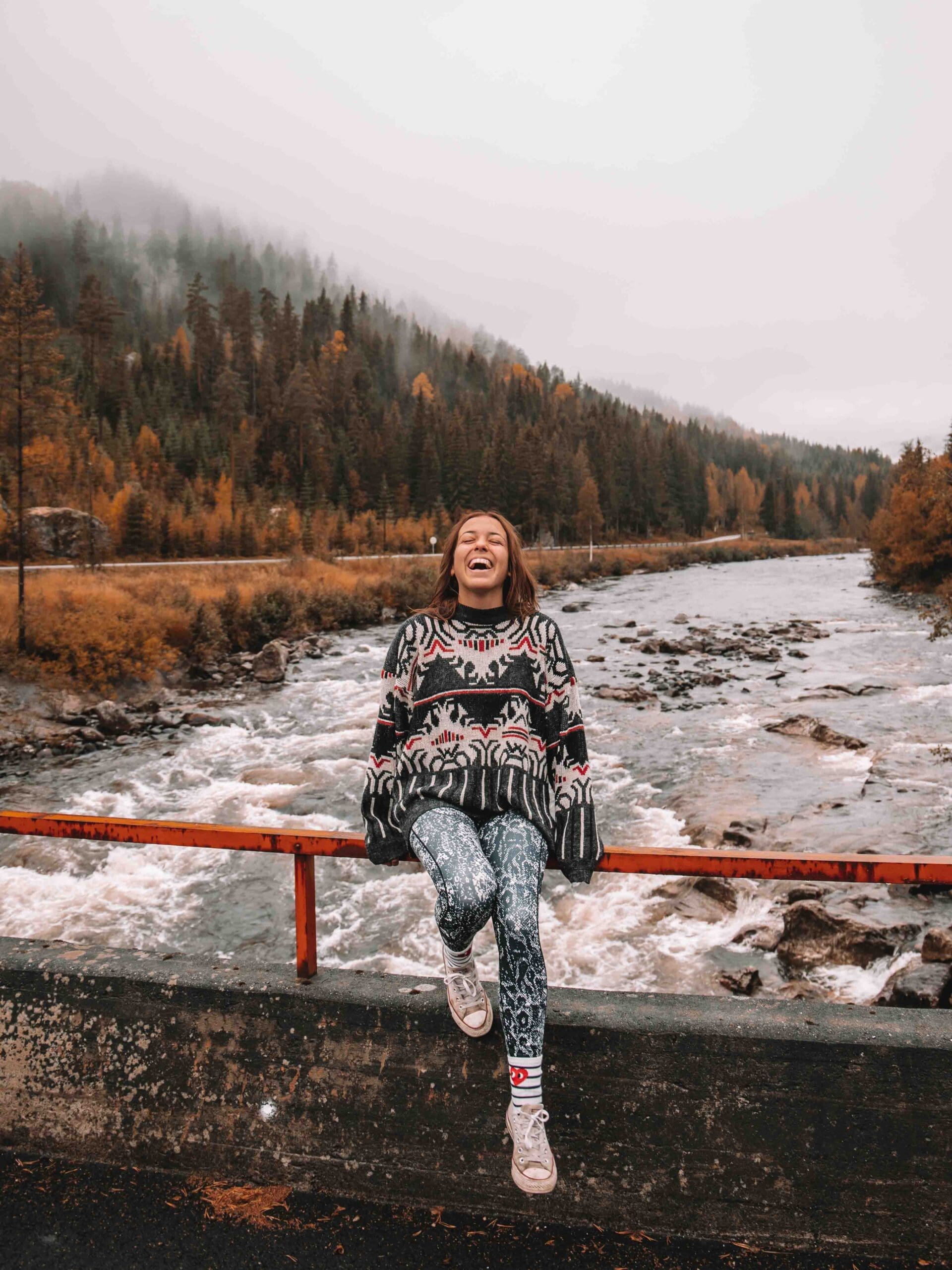 girl on bridge moody day autumn in norway