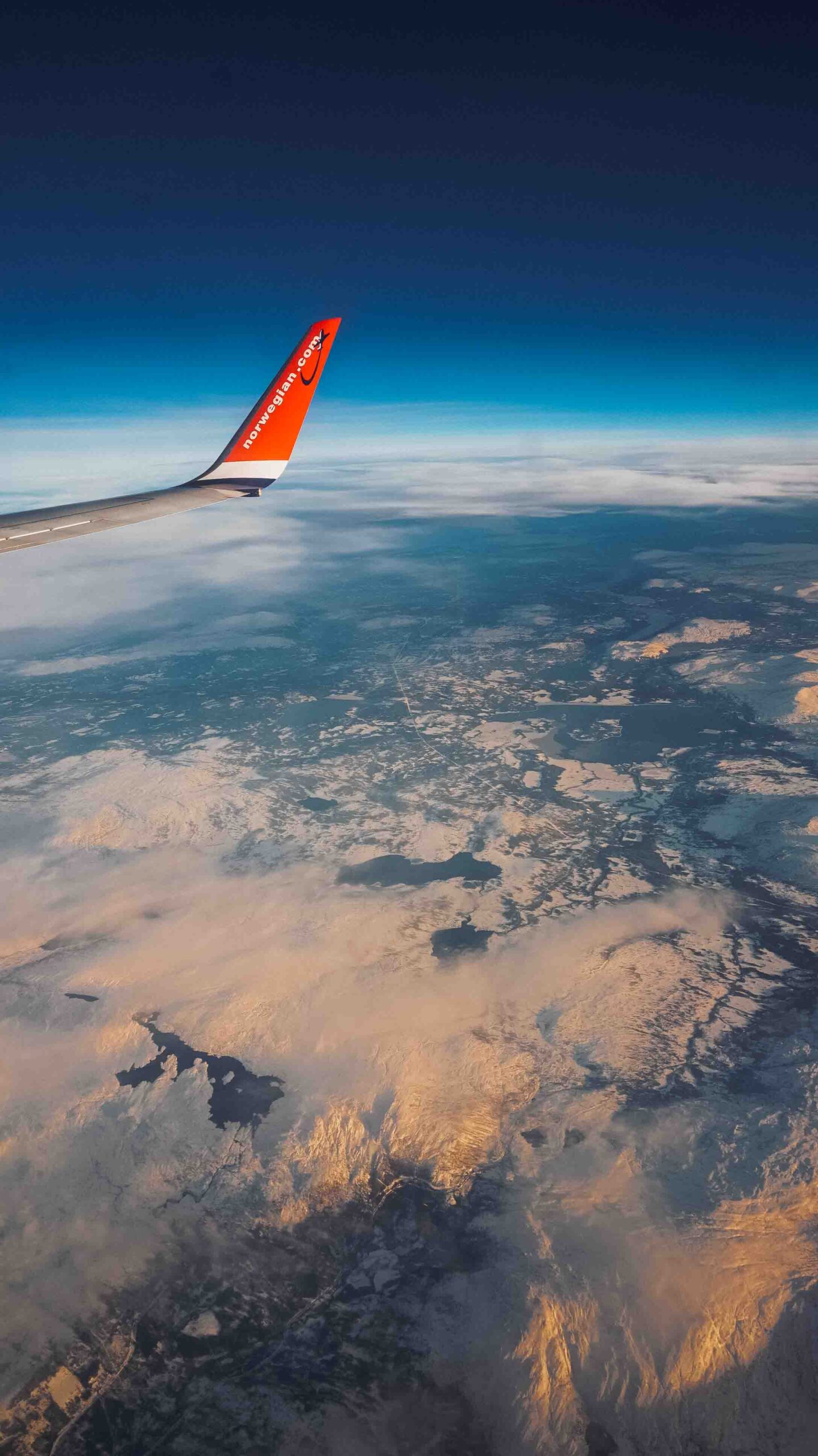 plane over lofoten islands in winter