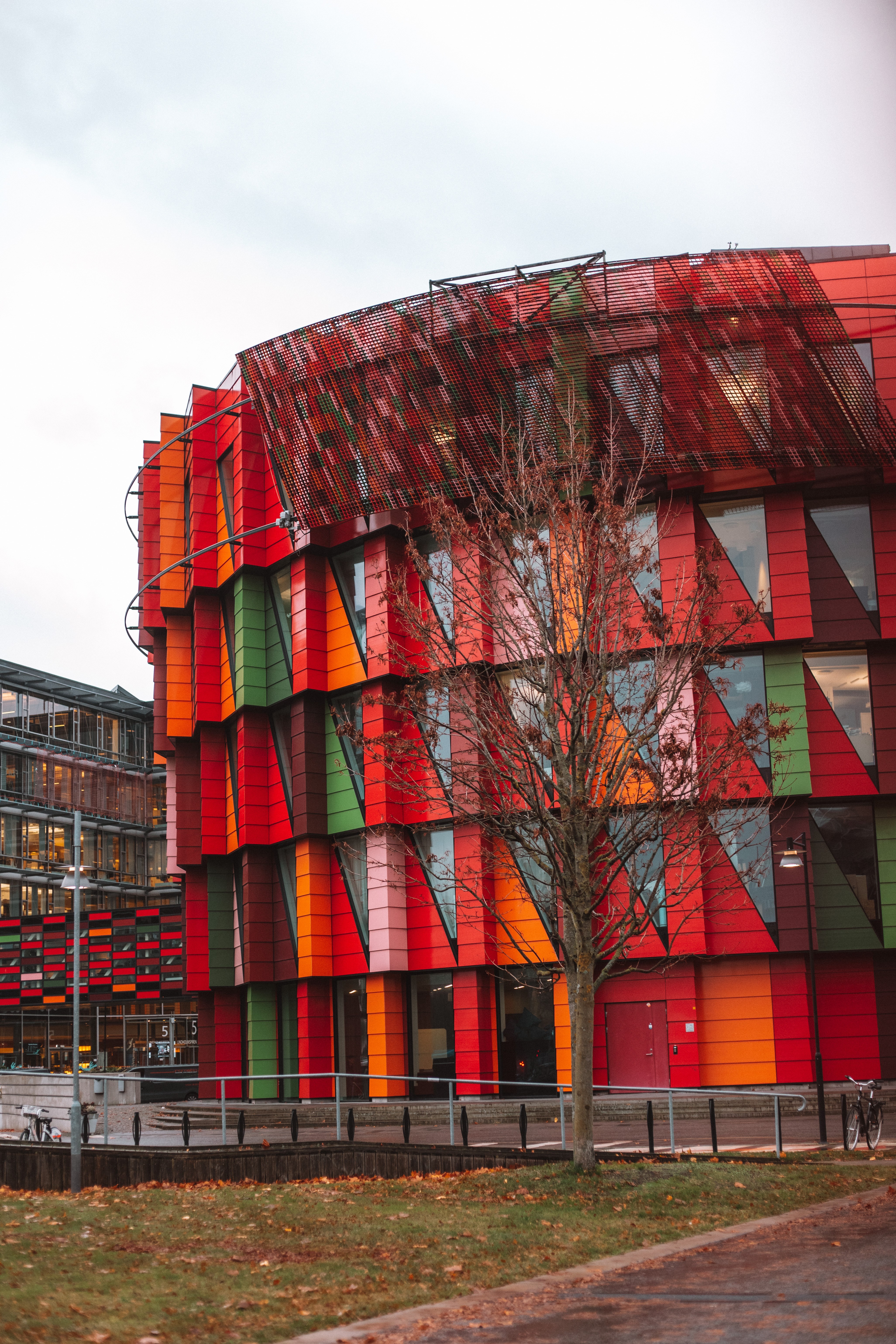 Kuggen building on Lindholmen - red, orange and green circular architecture