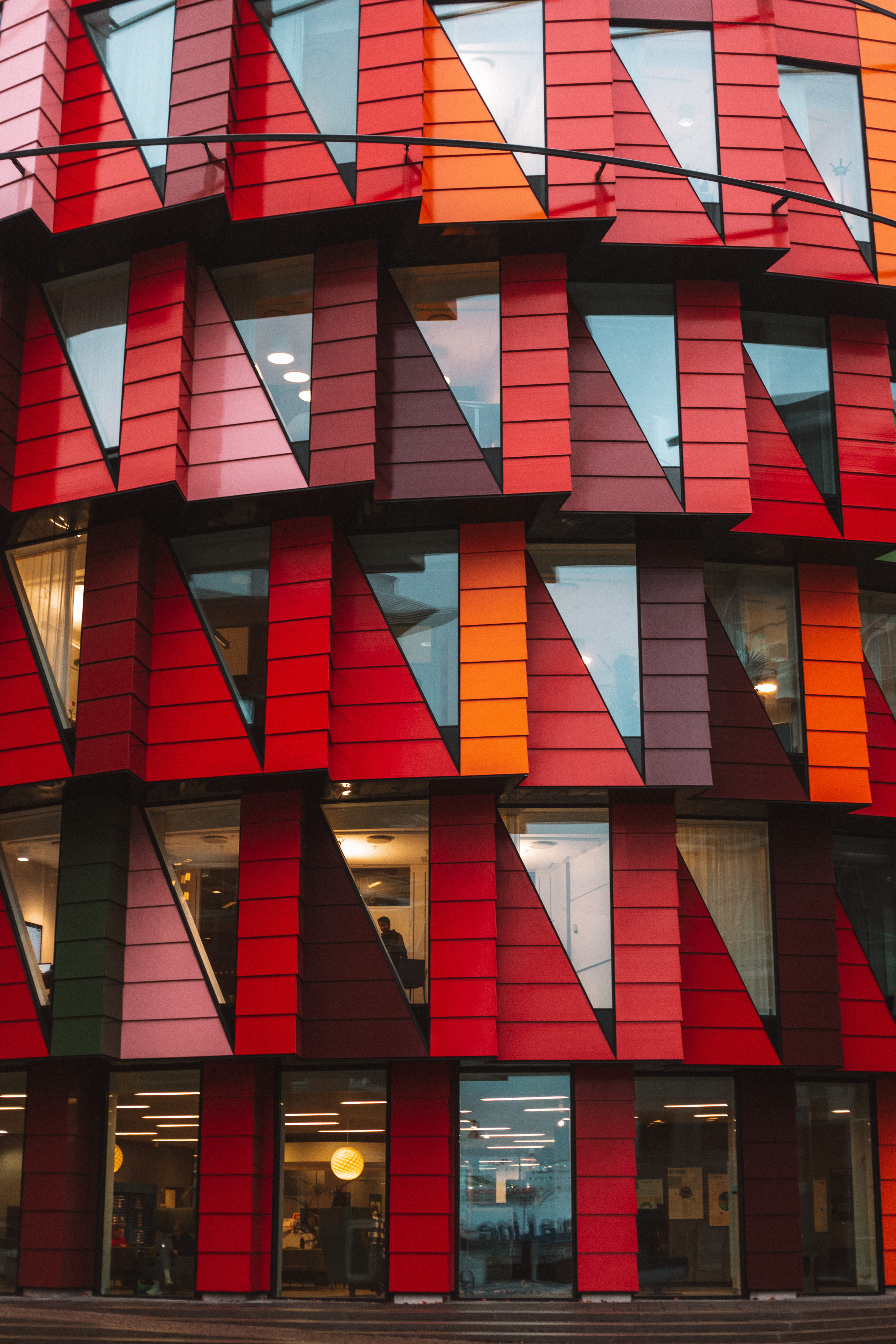 Kuggen building on Lindholmen - red, orange and green circular architecture