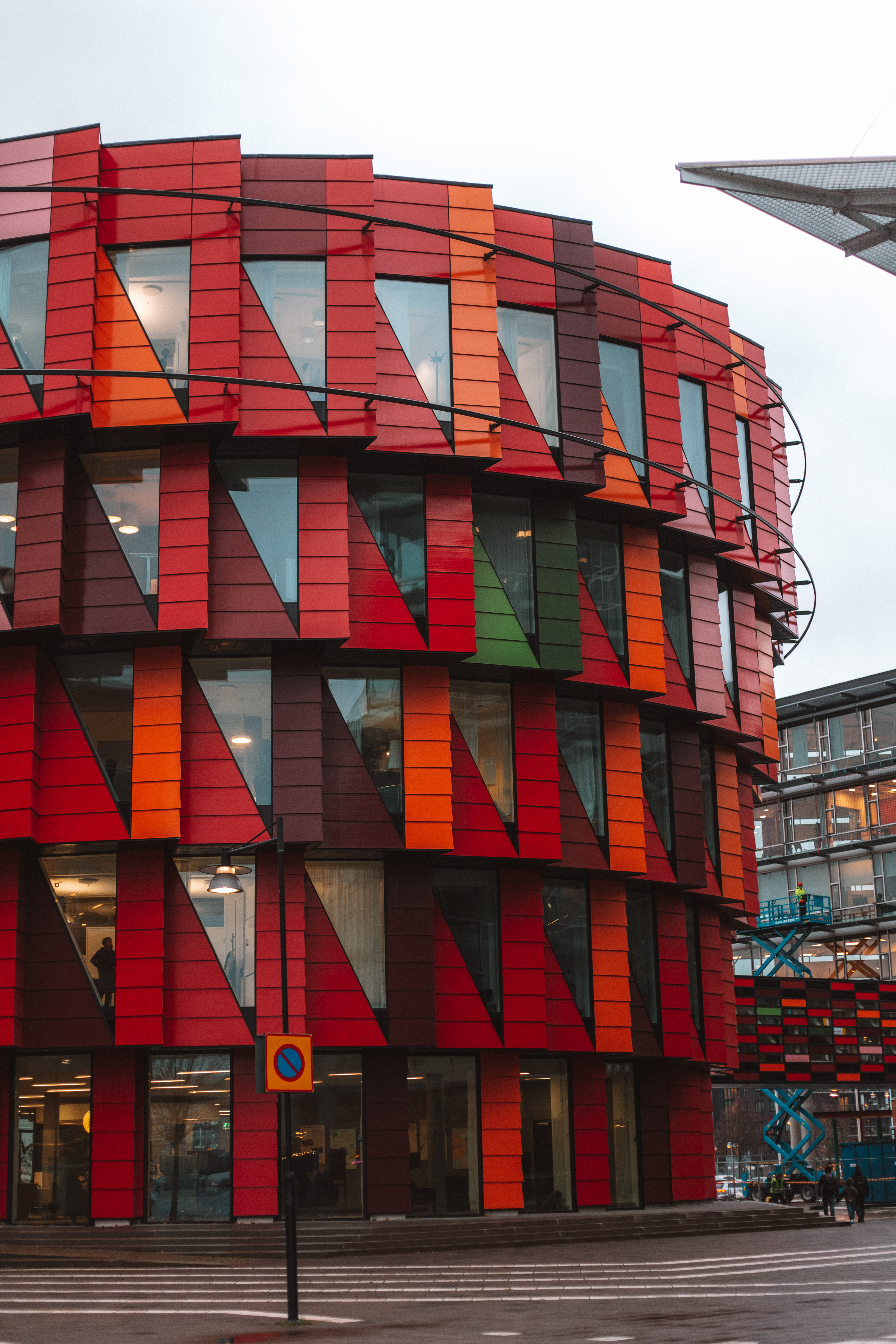 Kuggen building on Lindholmen - red, orange and green circular architecture