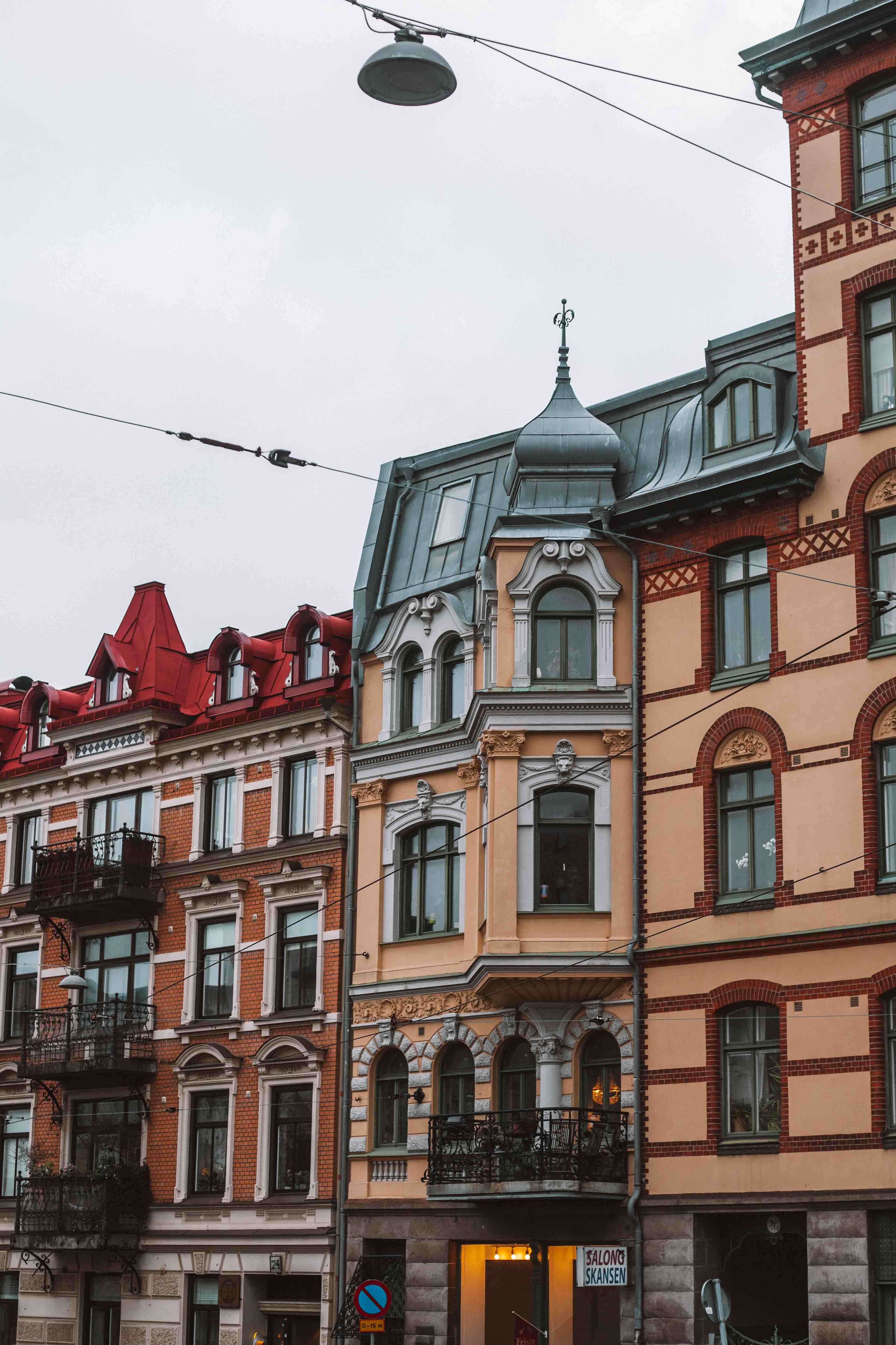 orange and green brick building in gothenburg