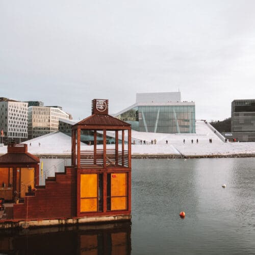 oslo fjord in winter. there is a sauna in front of the opera house