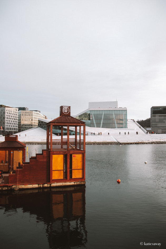 oslo fjord in winter. there is a sauna in front of the opera house