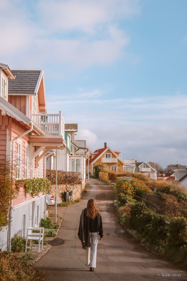 Girl walking through a colourful street in Mölle