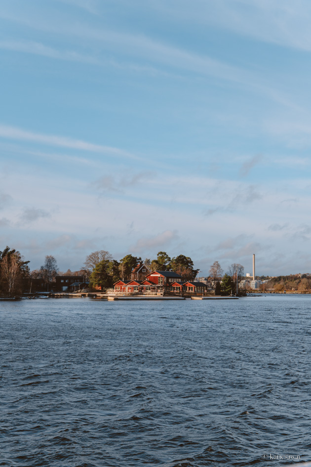 red boat houses in the stockholm archipelago in winter