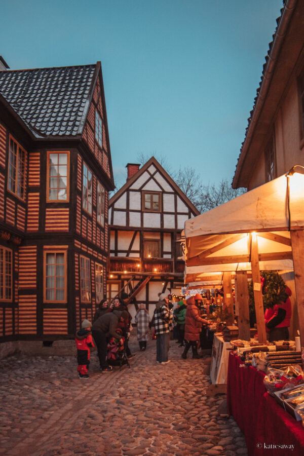 one of the streets in the norwegian folk museum with market stalls