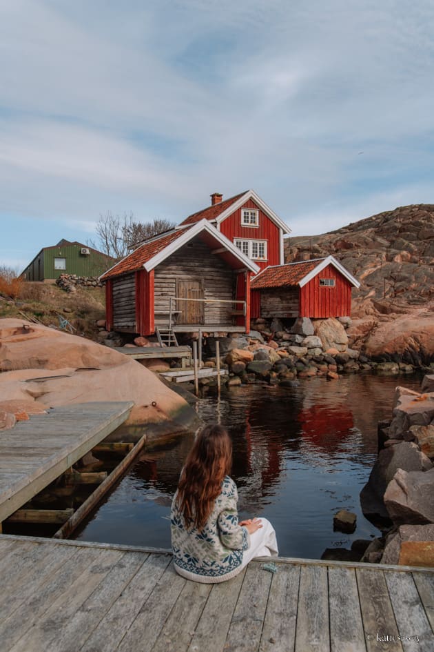 A collection of red boat houses that are a part of Vikarvet Cultural Reserve in Lysekil