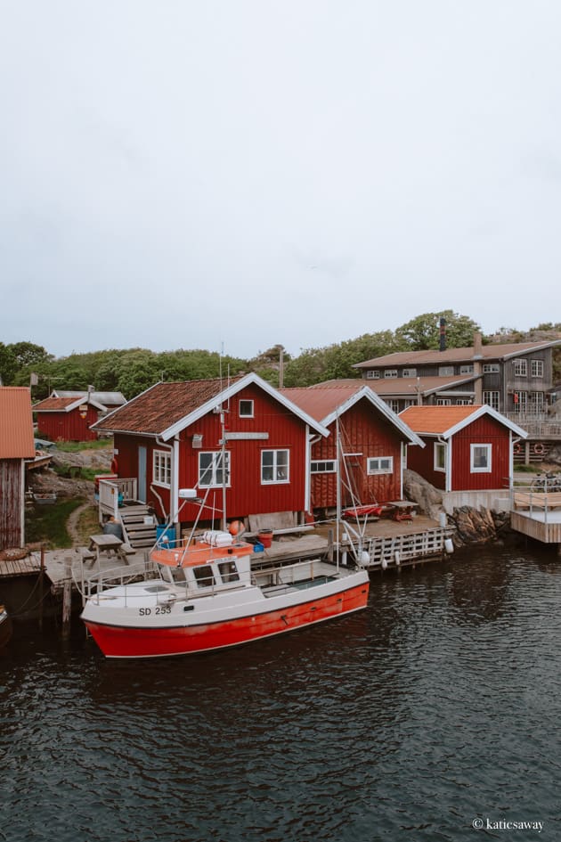 Boat houses and a fishing boat at a harbour on North Koster